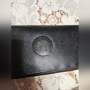 Black clutch wallet. Genuine leather outer. NWT